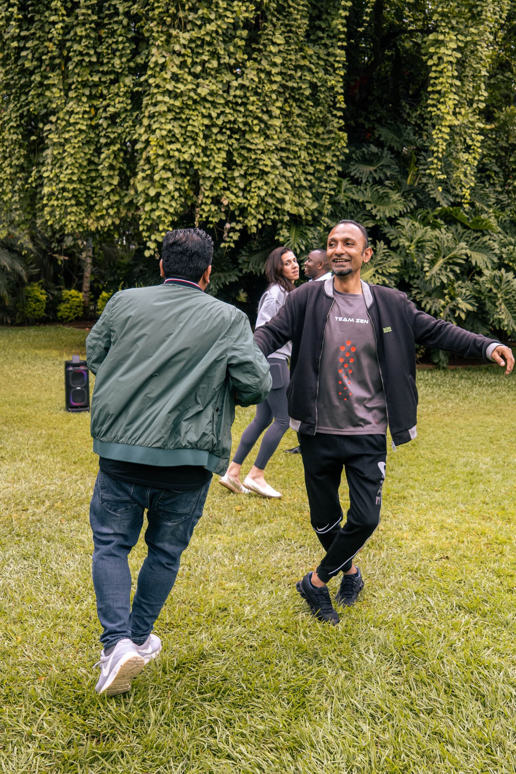 Corporate team gathered outdoors during a facilitated team building programme